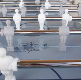 Namizni Nogomet Roberto Sport Summer Joy foosball players on a table with metallic rods, designed for outdoor use.